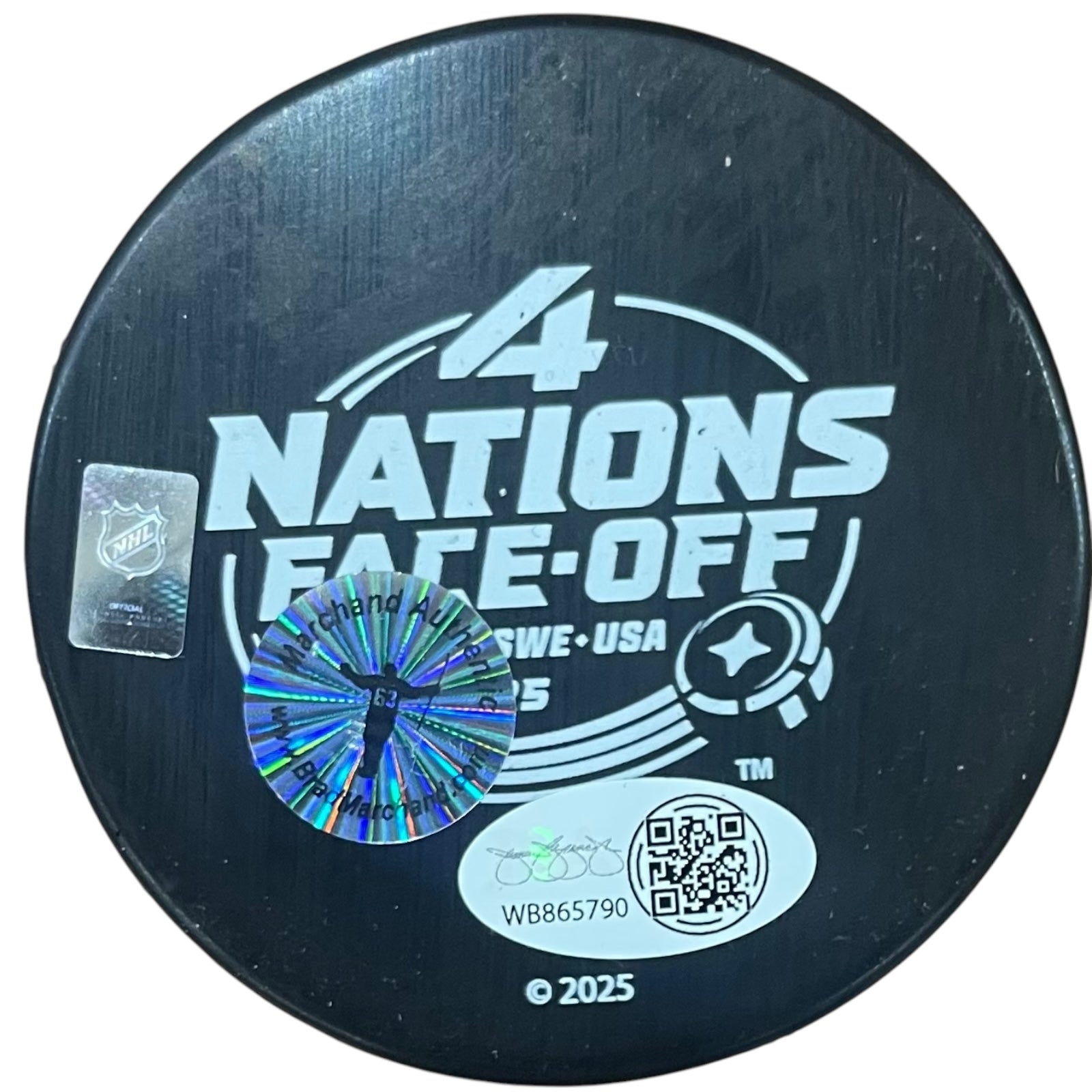 Autographed Brad Marchand Team Canada 4 Nations Hockey Puck with "Champs" Inscription